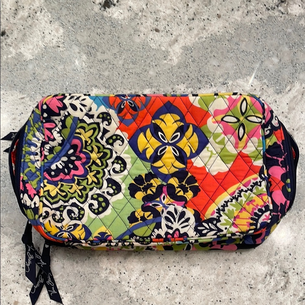 Vera Bradley travel toiletry bag with brush compartments.